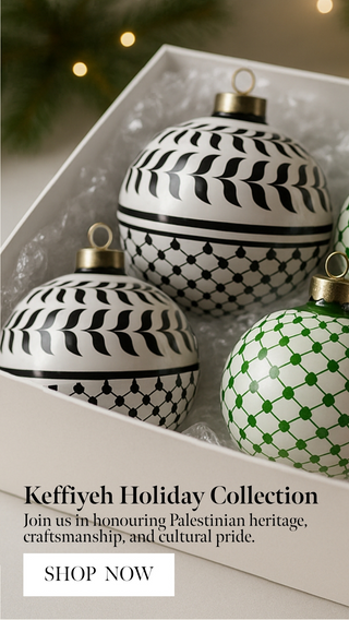 Decorative Christmas ornaments with keffiyeh patterns in a box, featuring text about the Keffiyeh Holiday Collection.