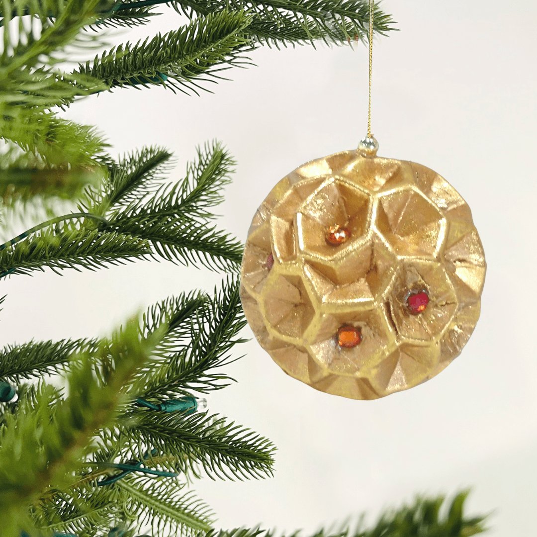 Carved Rose Gold Ornament with Red Detailing